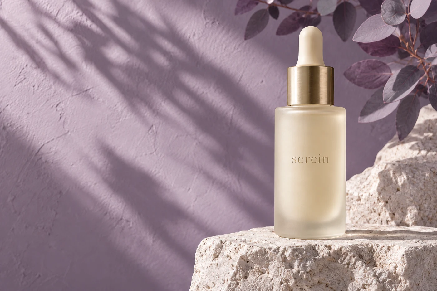 Serein skincare concept in lilac tones, with frosted glass and champagne metal detailing